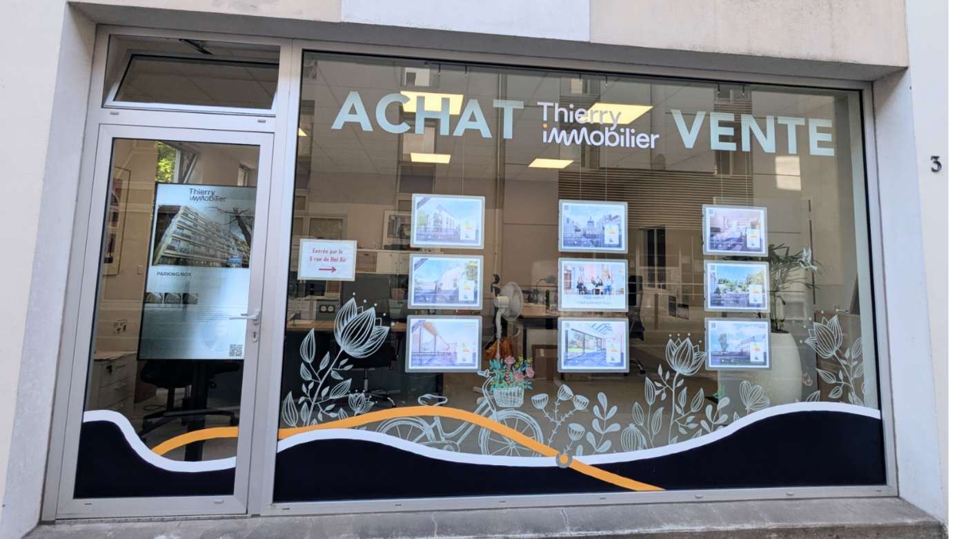 vitrine agence immobiliere thierry immobilier transaction nantes social immeuble 16x9